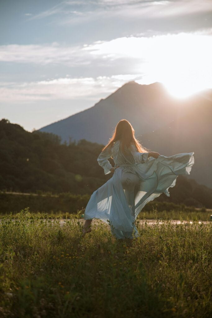 woman in blue dress dancing -336 Journaling Prompts for Deep and Meaningful Self Reflection