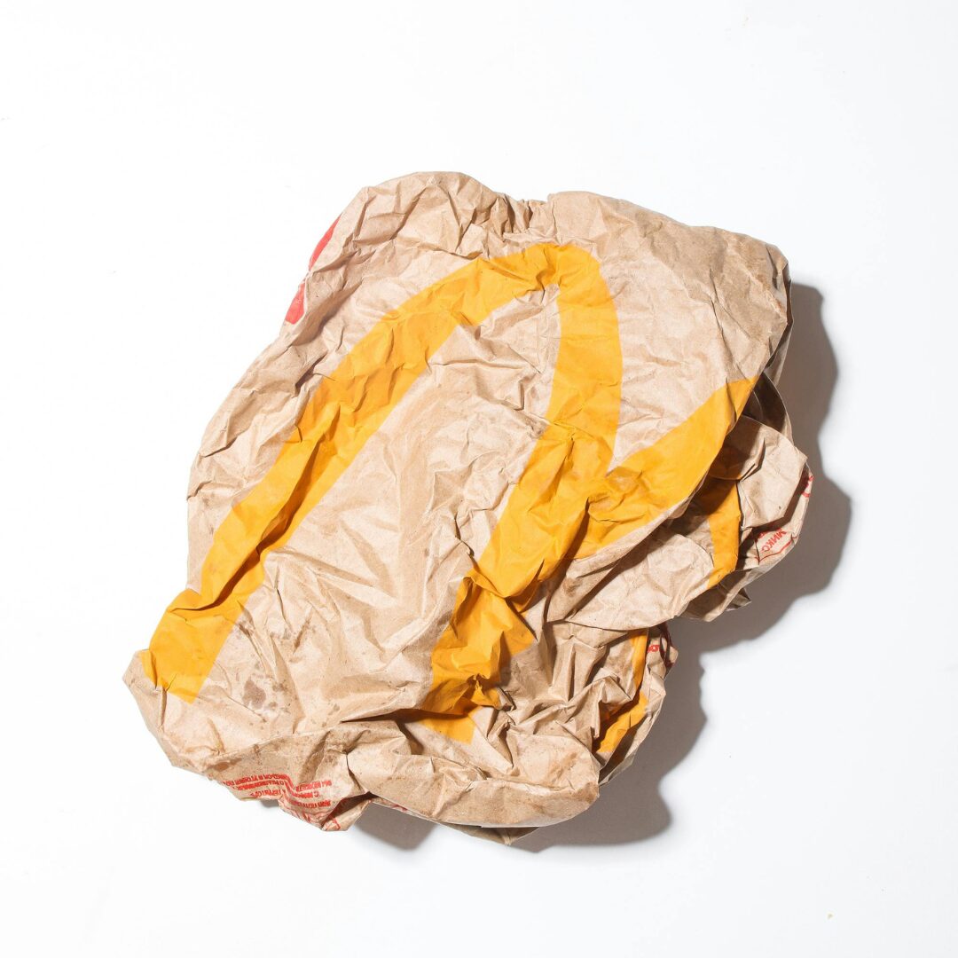 crumpled up McDonalds bag -Do You Waste Money 112 Things to Give Up NOW