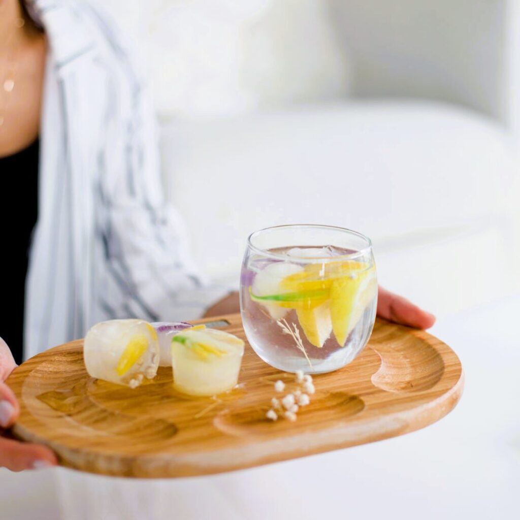 lemon water on a wooden serving tray -Can Drinking Water Boost Your Metabolism and Help You Lose Weight?