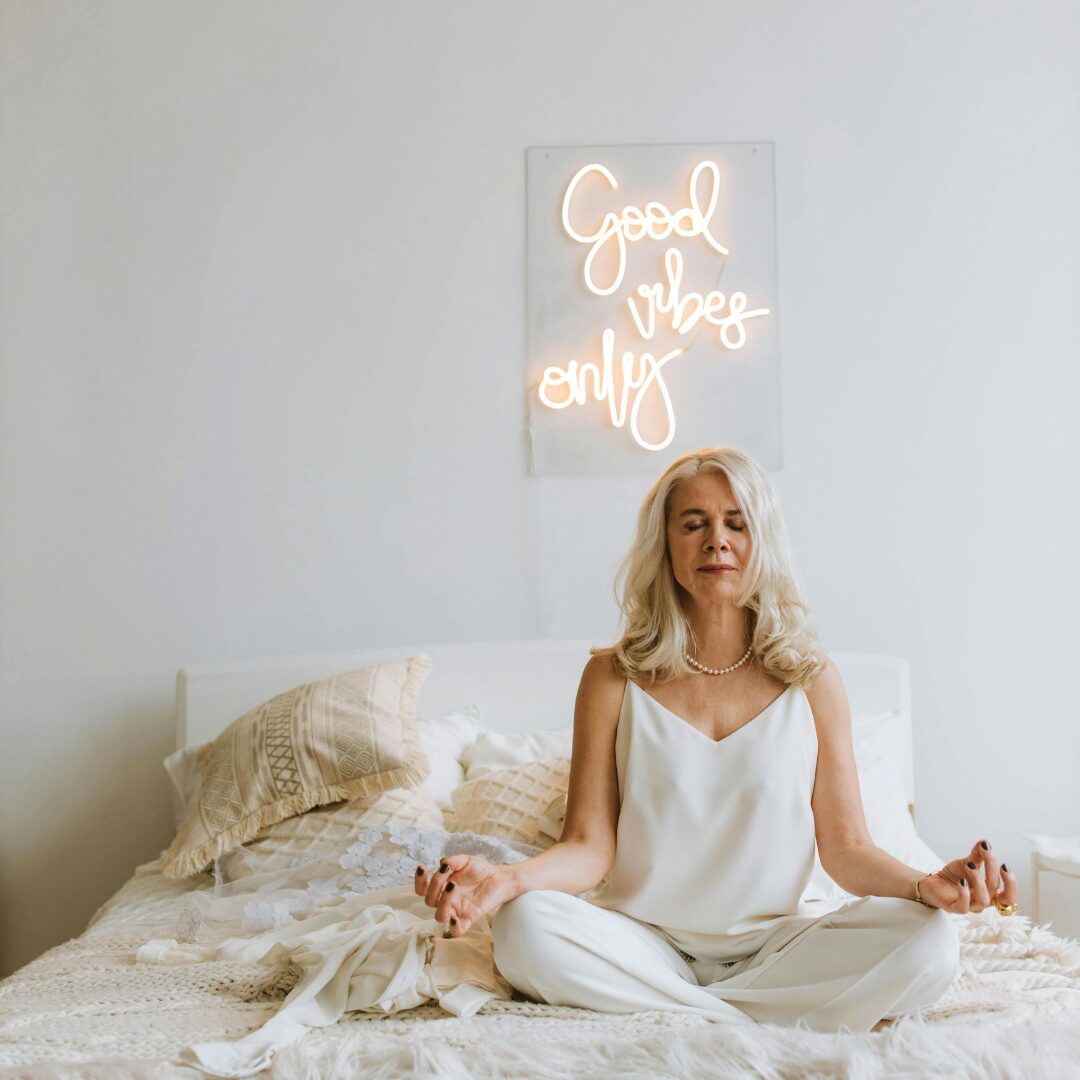 woman on a bed relaxing, meditating -How Stress Hormones Accelerate Aging: 4 Expert Tips to Slow It Down and Combat Aging