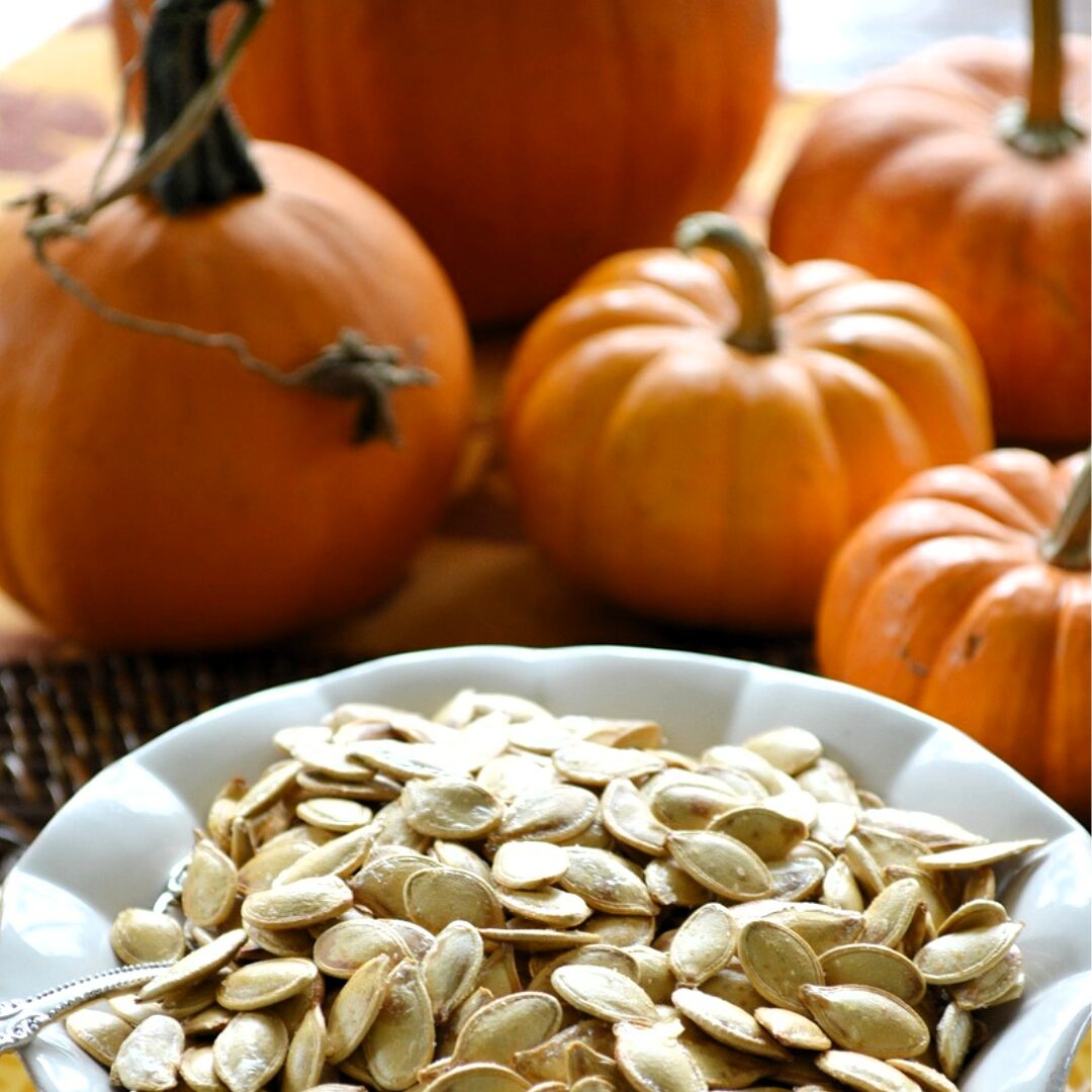 pumpkins and roasted pumpkin seeds -A Guide to Roasting Pumpkin Seeds and 5 Amazing Recipes