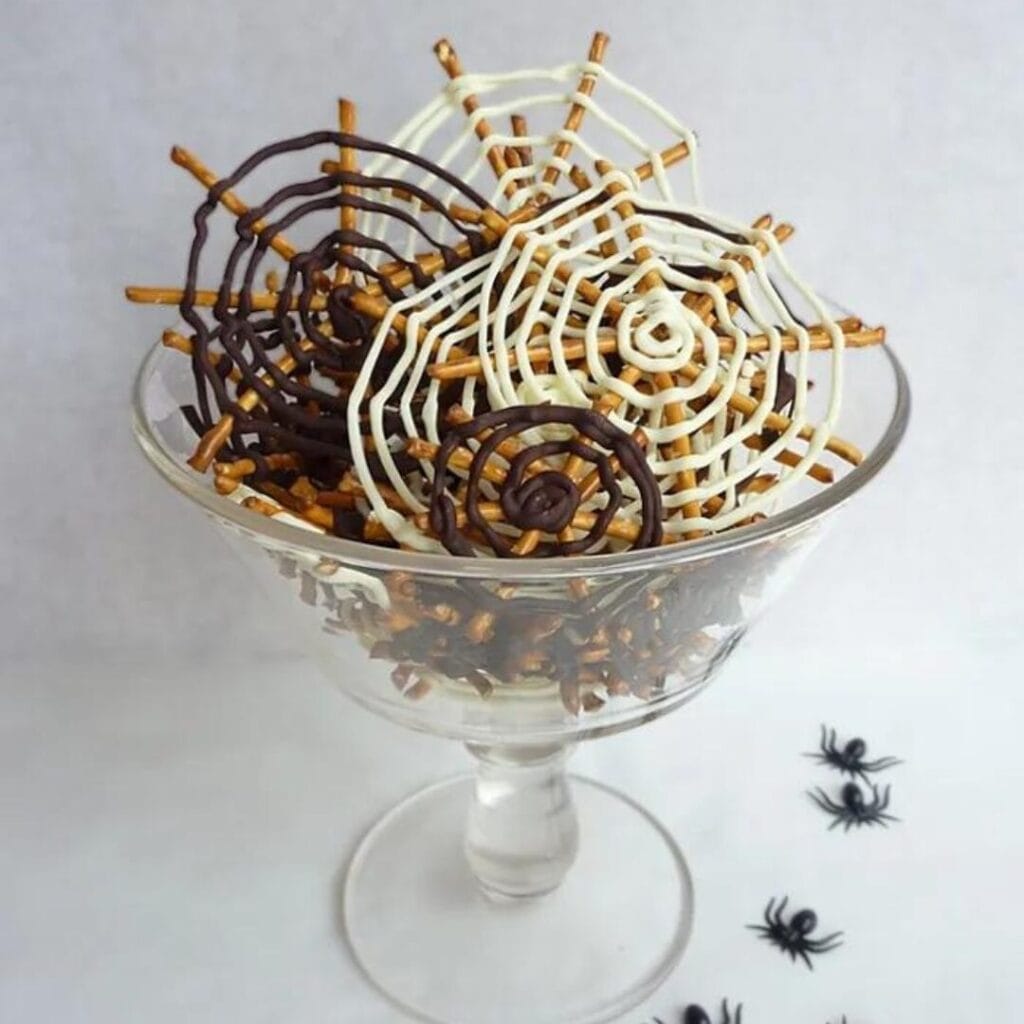 Halloween Chocolate Pretzel Spider Webs -30+ Spooky Halloween Treats Your Kids Will Love