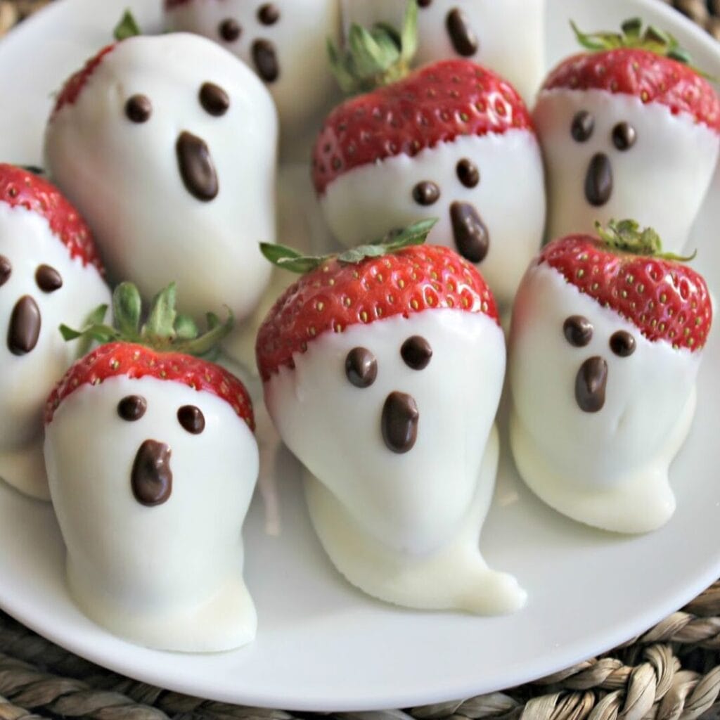 White Chocolate Strawberry Ghosts -30+ Spooky Halloween Treats Your Kids Will Love