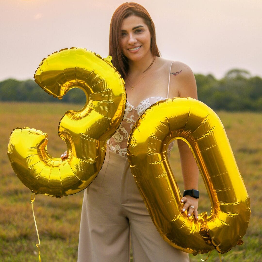 Smiling Woman with Birthday Balloons - 17 Fun 30th Birthday Quotes to Celebrate a Milestone Year