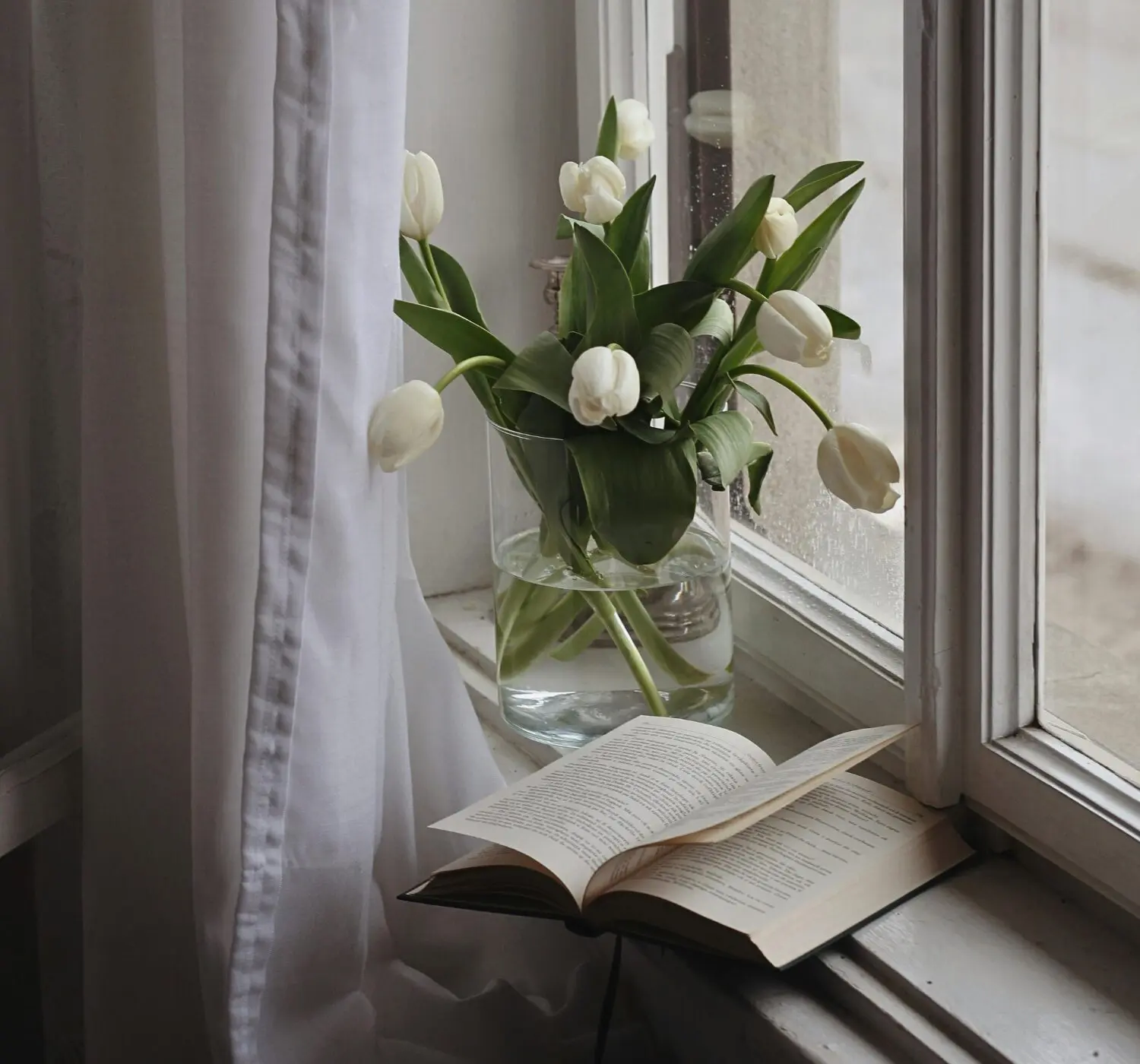 flowers in a vase and a book -9 Honest Reasons Why Slowing Down Feels Scary—And Why That’s Okay